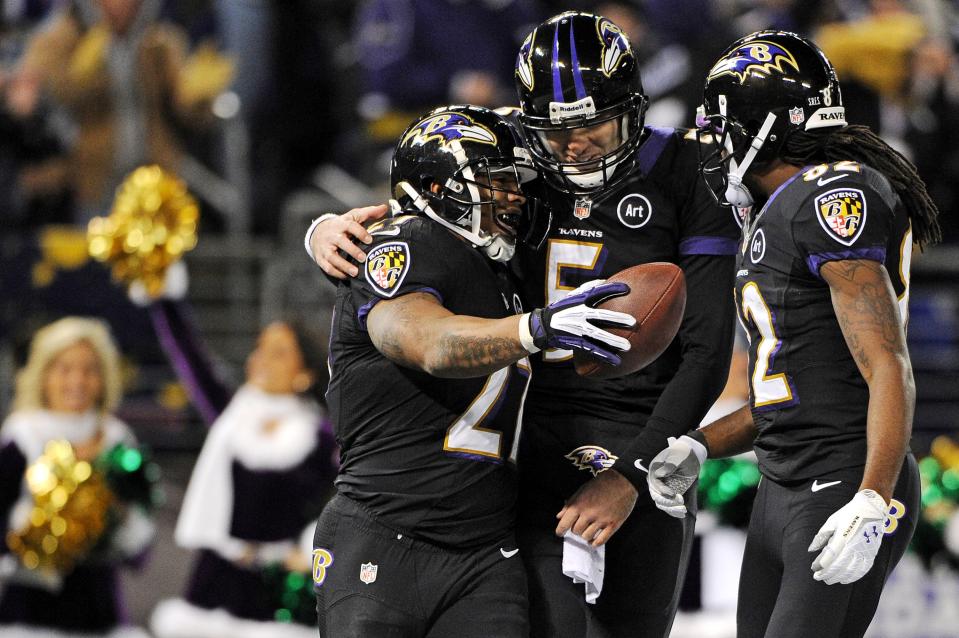 Running back Ray Rice #27 of the Baltimore Ravens celebrates with teammates quarterback Joe Flacco #5 and wide receiver Torrey Smith #82 after scoring a touchdown against the New York Giants in the second quarter at M&T Bank Stadium on December 23, 2012 in Baltimore, Maryland. (Photo by Patrick Smith/Getty Images)