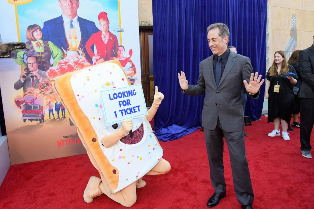 Jerry Seinfeld promotes his Netflix film 'Unfrosted,' which tells the story behind the launch of Kellogg's Pop-Tarts. <a href="https://www.gettyimages.com/detail/news-photo/actor-jerry-seinfeld-holds-a-pop-tart-as-he-attends-news-photo/2150411110?searchscope=image%2Cfilm&adppopup=true" rel="nofollow noopener" target="_blank" data-ylk="slk:Frederic J. Brown/via Getty Images;elm:context_link;itc:0;sec:content-canvas" class="link ">Frederic J. Brown/via Getty Images</a>