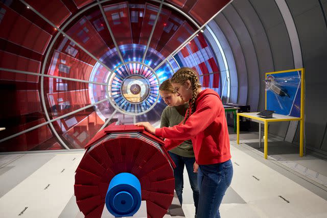 <p>Courtesy of CERN Science Gateway</p> Young visitors explore the “Discover CERN: Collide” exhibition at the Gateway.