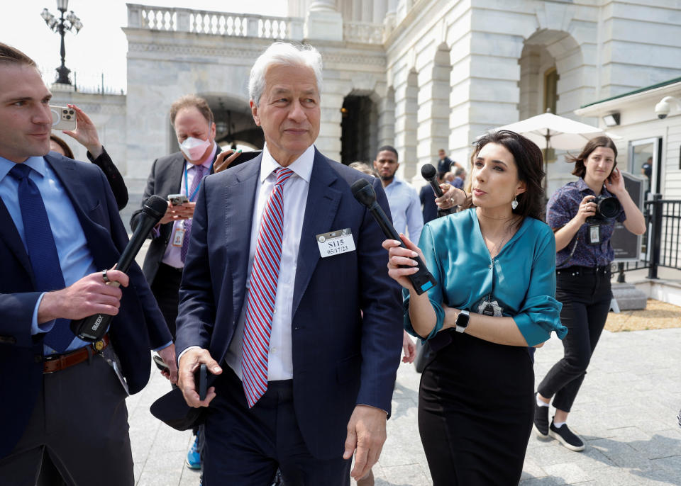 JPMorgan Chase CEO Jamie Dimon talks to reporters as he leaves the U.S. Capitol after an unannounced meeting with U.S. Senate Majority Leader Schumer that was reportedly about the possibility of the U.S. defaulting on its debt, outside the U.S. Capitol in Washington, U.S., May 17, 2023. REUTERS/Evelyn Hockstein