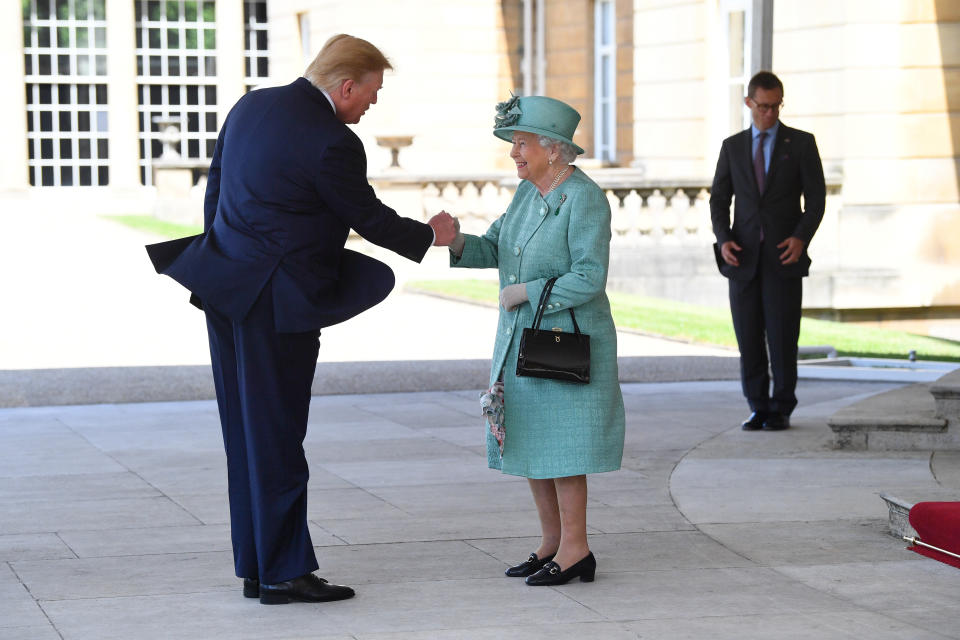 Queen Elizabeth II greets US President Donald Trump as he arrives for the Ceremonial Welcome at Buckingham Palace, London, on day one of his three day state visit to the UK.