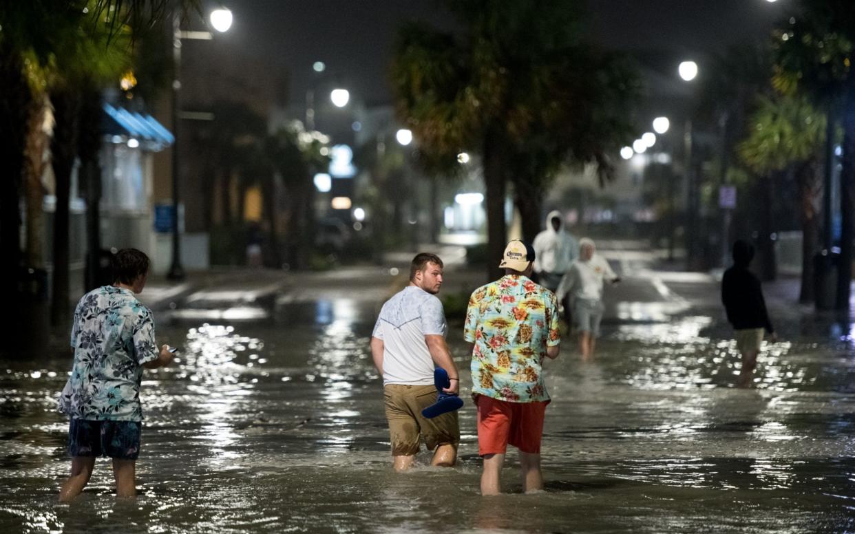 Residents of Myrtle Beach, South Carolina walk through floodwaters brought by Hurricane Isaias -  Sean Rayford/ Getty Images North America