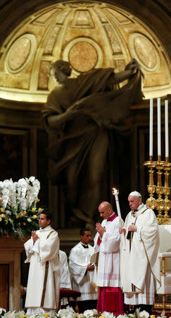 Pope Francis leads the Easter vigil Mass in Saint Peter's Basilica at the Vatican, April 20, 2019. REUTERS/Remo Casilli