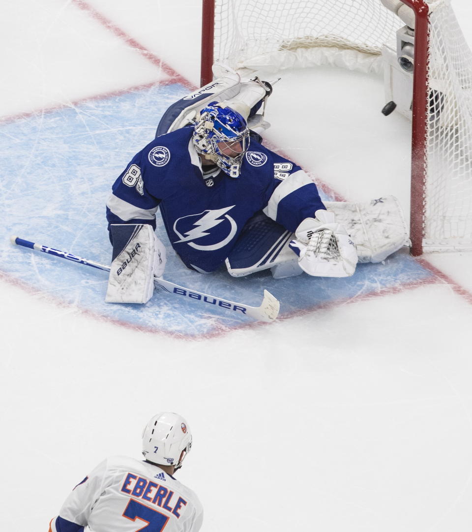 New York Islanders right wing Jordan Eberle (7) scores on Tampa Bay Lightning goaltender Andrei Vasilevskiy (88) during the second overtime in Game 5 of the NHL hockey Eastern Conference final, Tuesday, Sept. 15, 2020, in Edmonton, Alberta. (Jason Franson/The Canadian Press via AP)