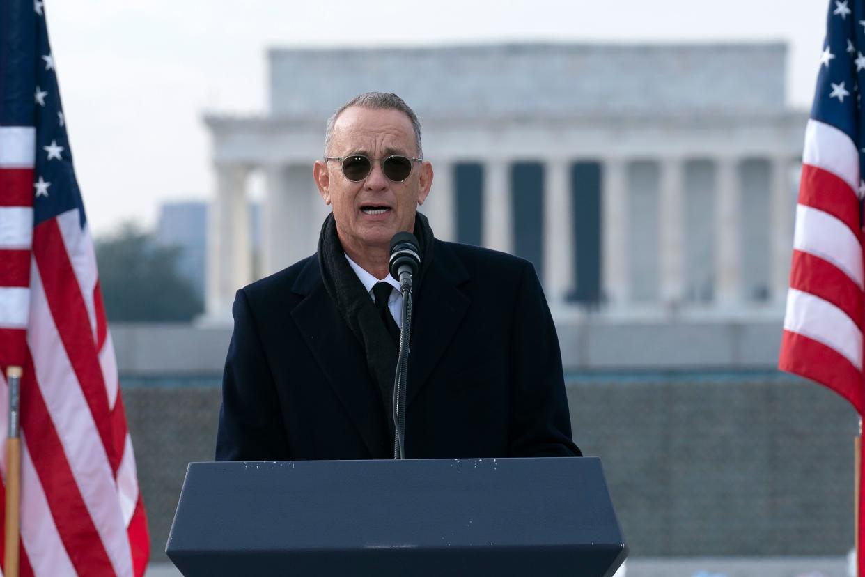 With the Lincoln Memorial in the background, actor and filmmaker Tom Hanks speaks during a ceremony in honor of former Sen. Bob Dole, R-Kan., at the National World War II Memorial, on Friday, Dec. 10, 2021, in Washington.