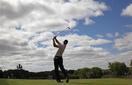 Zach Johnson of the U.S. hits an approach shot during the final round at the BMW Championship golf tournament at the Conway Farms Golf Club in Lake Forest, Illinois, September 16, 2013. REUTERS/Jim Young