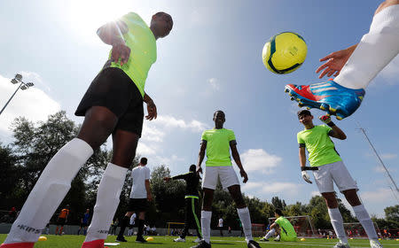 Asylum seekers take part in the soccer tournament "All on the pitch" organised by NGO's and Belgian Football Association at the occasion of the World Refugee Day, in Deurne, Belgium June 20, 2018. REUTERS/Yves Herman