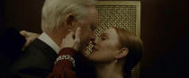 This image released by Apple TV+ shows John Lithgow and Julianne Moore in a scene from "Sharper." (Apple TV+ via AP)