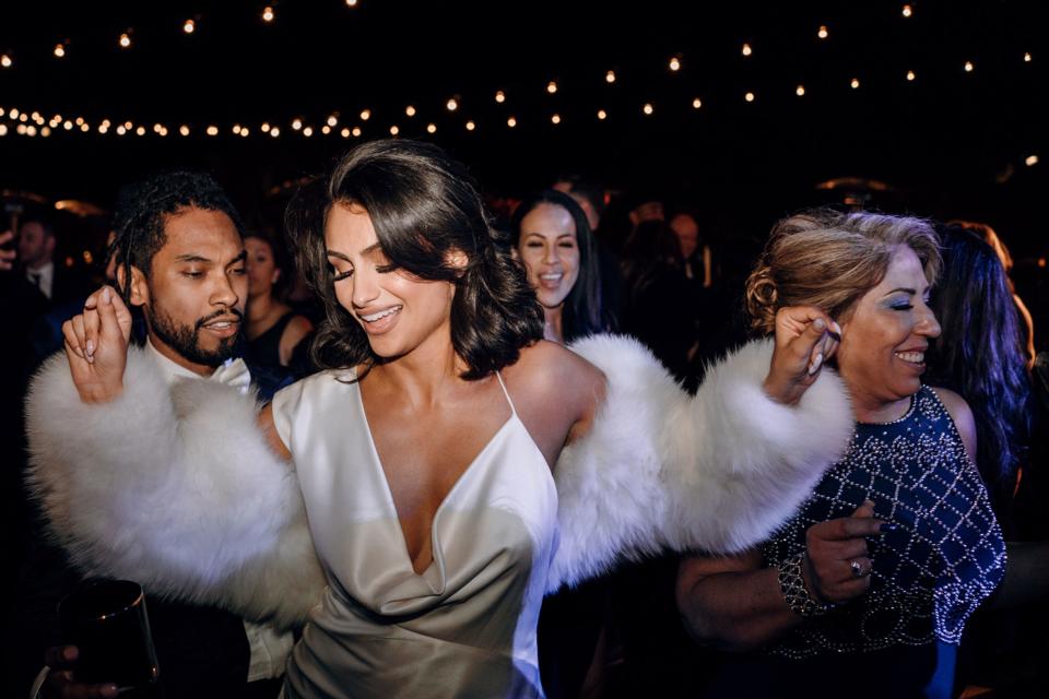 When Nazanin Mandi married Miguel at the Hummingbird Nest Ranch near Los Angeles, she wore a classic updo and a dramatic eyeliner.
