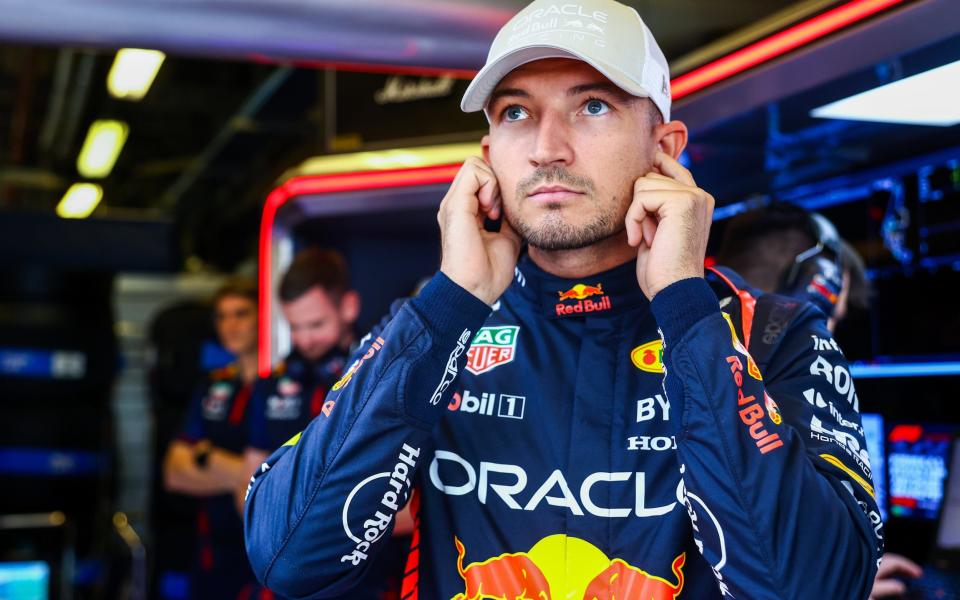 Jake Dennis of Great Britain and Red Bull Racing prepares to drive in the garage prior to practice ahead of the F1 Grand Prix of Abu Dhabi at Yas Marina Circuit on November 24, 2023 in Abu Dhabi, United Arab Emirates.