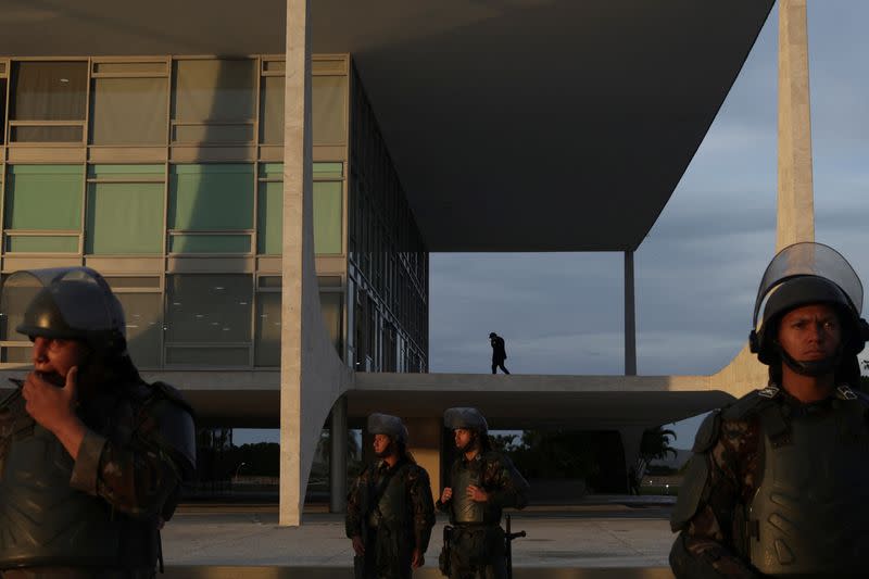 Army soldiers stand guard outside Planalto Palace, in Brasilia