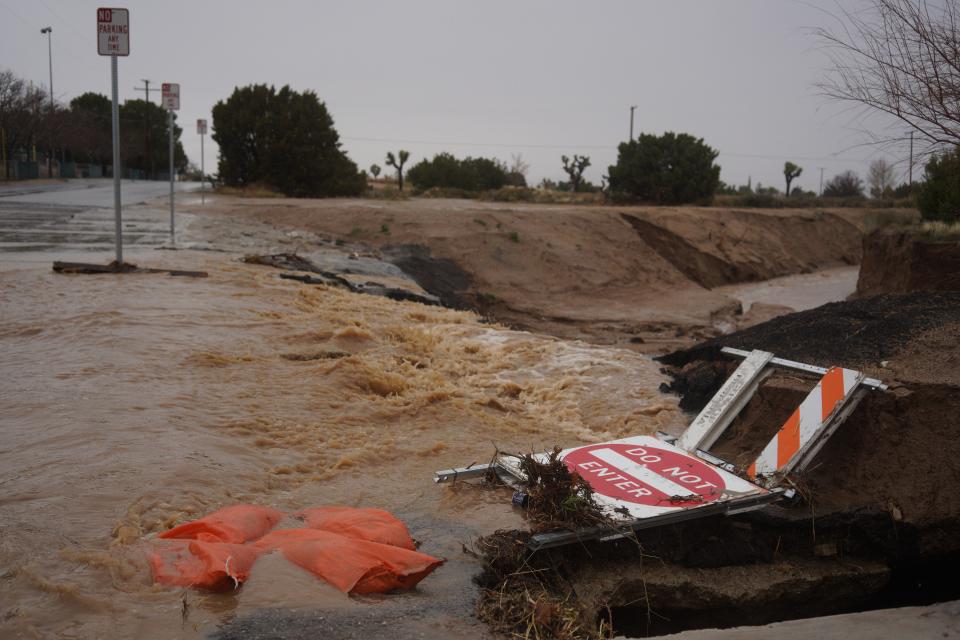 Rain water passes through a flood control channel on Datura Rd. near Hesperia Community Park on Monday, Feb. 5th, 2024 in Hesperia.