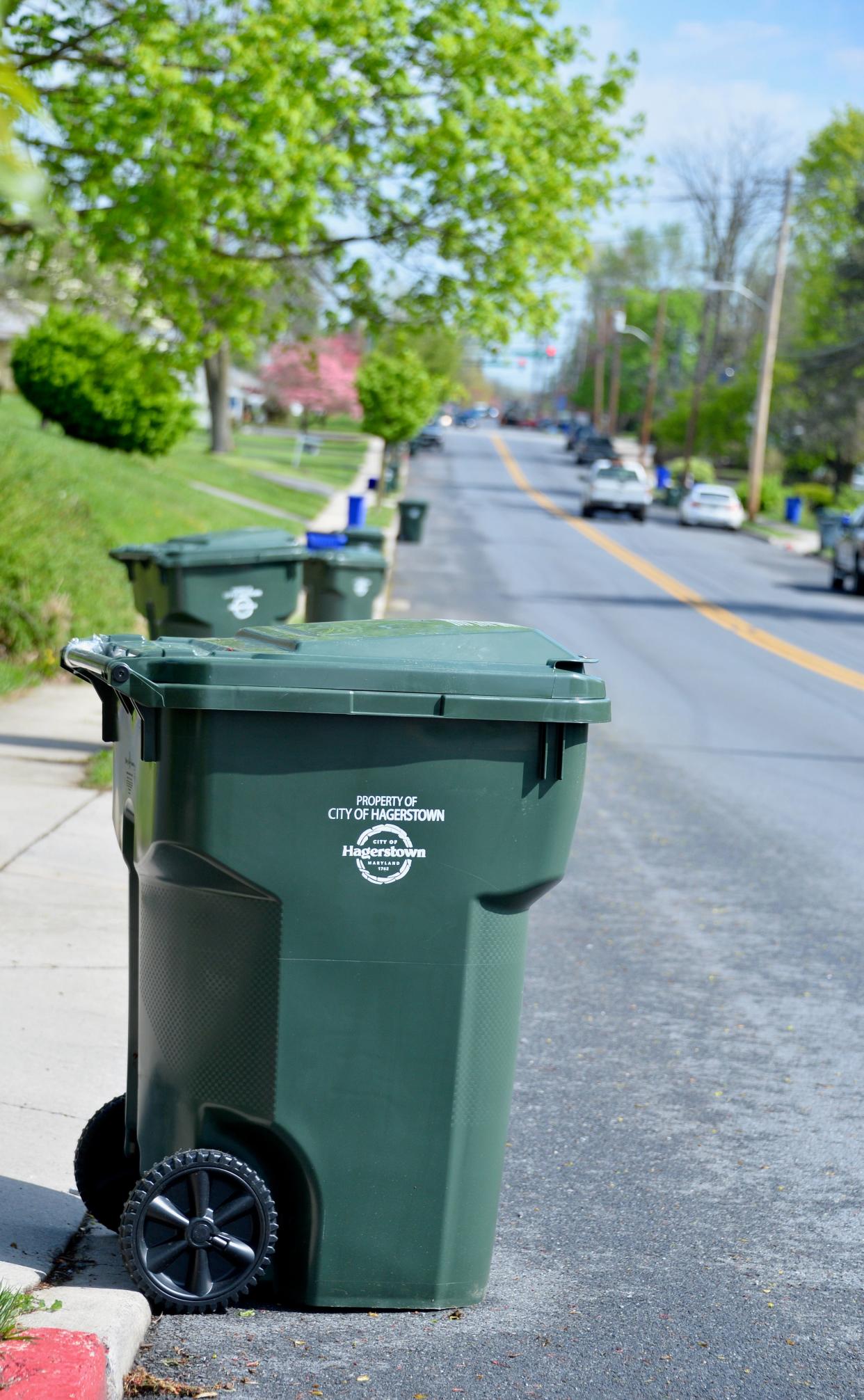 Several of the City of Hagerstown's new 95-gallon residential trash totes along Nottingham Road on Monday, April 15, 2024.