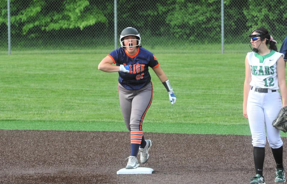 Galion's Destiny Blue pounds her chest in excitement after driving in a pair of runs.