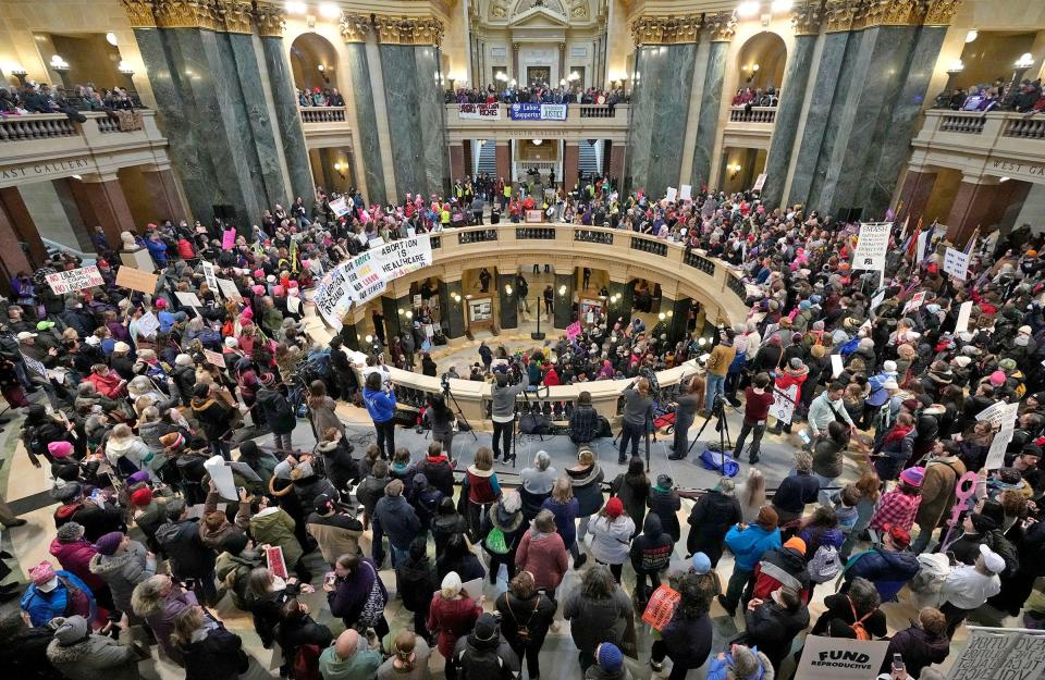 Thousands gather during the National Women's March at the Capitol rotunda marking 50th anniversary of the Roe v. Wade decision, in Madison on Sunday, Jan. 22, 2023. Protesters demonstrated their opposition to last year's landmark U.S. Supreme Court ruling that made Wisconsin the epicenter of a national battle over abortion access.