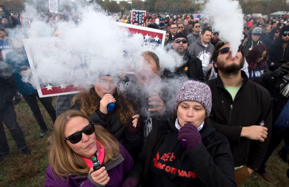 <div class="inline-image__caption"><p>Protesters vape during a 2019 rally outside of the White House to protest the proposed vaping flavor ban.</p></div> <div class="inline-image__credit">Jose Luis Magana/AFP via Getty</div>