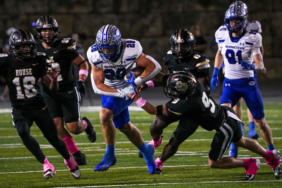 Georgetown running back Jett Walker (28) runs the ball during the game against Rouse at John Gupton Stadium on Thursday, Oct. 10, 2024 in Cedar Park, Texas.