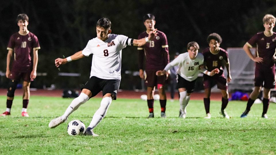 Oliver Ames' Ryan Linhares takes a penalty kick during a game against Sharon on Monday, Oct. 23, 2023.