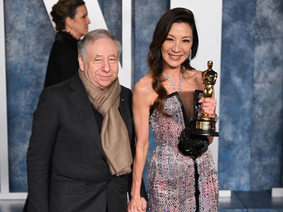 French motor racing executive Jean Todt (L) and Malaysian actress Michelle Yeoh attend the 2023 Vanity Fair Oscar Party.