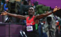 LONDON, ENGLAND - AUGUST 09: David Lekuta Rudisha of Kenya celebrates after winning gold and setting a new world record of 1.40.91 in the Men's 800m Final on Day 13 of the London 2012 Olympic Games at Olympic Stadium on August 9, 2012 in London, England. (Photo by Alexander Hassenstein/Getty Images)