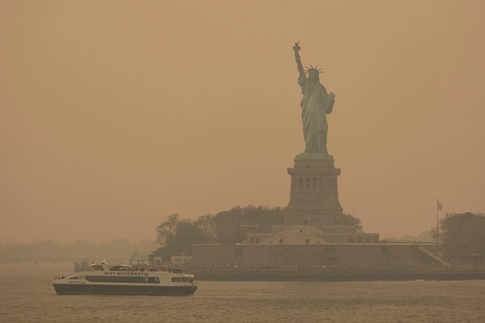 Smoke obscures the Statue of Liberty