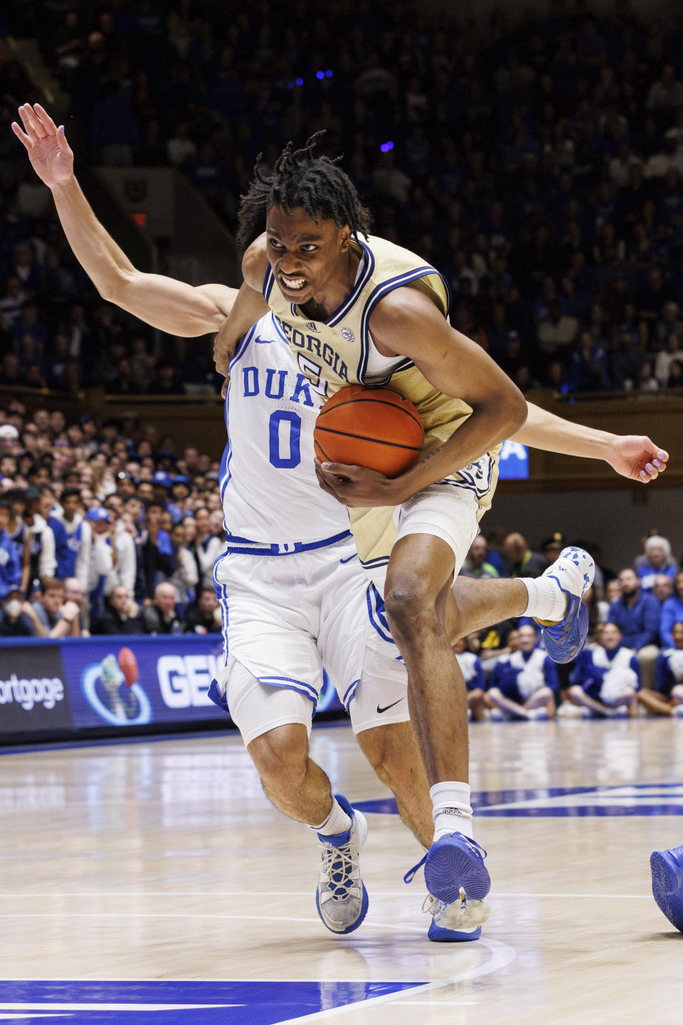 Georgia Tech's Tafara Gapare (5) drives as Duke's Jared McCain (0) defends during the first half of an NCAA college basketball game in Durham, N.C., Saturday, Jan. 13, 2024. (AP Photo/Ben McKeown)