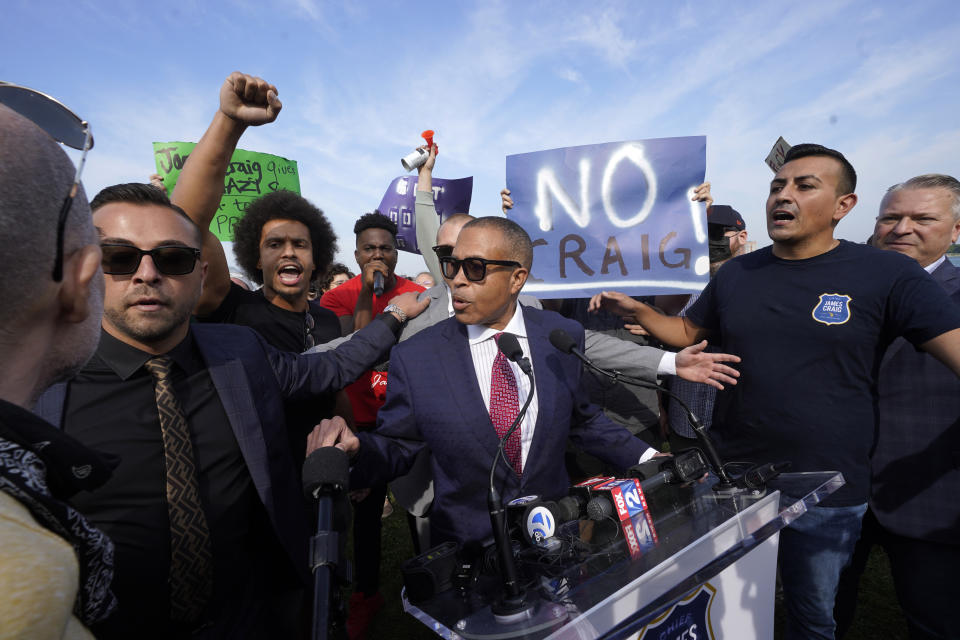 James Craig, a former Detroit Police Chief, announces he is a Republican candidate for Governor of Michigan amongst protesters on Belle Isle in Detroit, Tuesday, Sept. 14, 2021. (AP Photo/Paul Sancya)