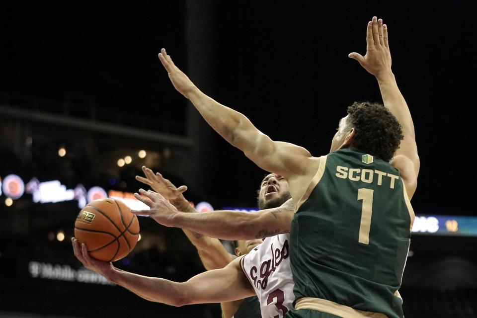 Boston College guard Jaeden Zackery (3) shoots under pressure from Colorado State forward Joel Scott (1) during the first half of an NCAA college basketball game Wednesday, Nov. 22, 2023, in Kansas City, Mo. (AP Photo/Charlie Riedel)