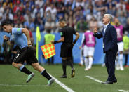 <p>France head coach Didier Deschamps yells as Uruguay’s Cristian Rodriguez, left, replaces Uruguay’s Rodrigo Bentancur </p>