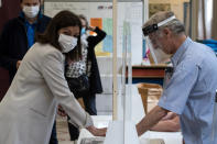 Current socialist Paris mayor and candidate in the second round of the municipal elections Anne Hidalgo casts her ballot Sunday, June 28, 2020 in Paris. France is holding the second round of municipal elections in 5,000 towns and cities Sunday that got postponed due to the country's coronavirus outbreak. (Joel Saget, Pool via AP)