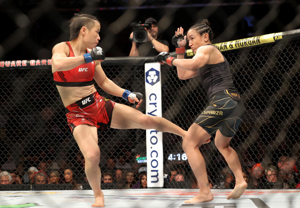 Carla Esparza (red gloves) and Zhang Weili (blue gloves) during UFC 281 at Madison Square Garden. (Jessica Alcheh, USA TODAY Sports)