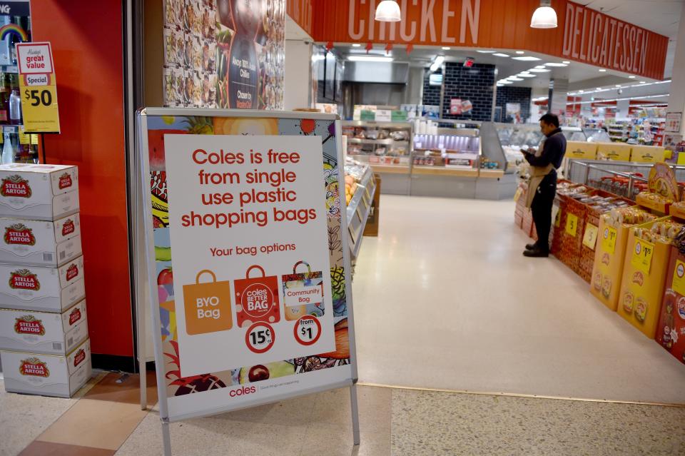 A sign, seen in a Coles supermarket, advises its customers of its plastic bag free in Sydney on July 2, 2018.