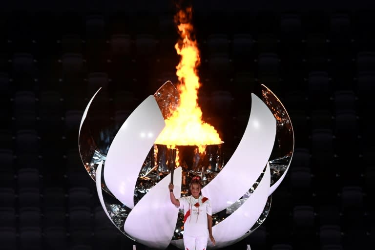 Olympic return? Naomi Osaka lights the cauldron at the opening ceremony of the Tokyo Games in 2021 (Jewel SAMAD)