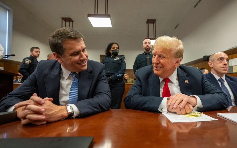 Donald Trump sitting between his defence lawyers, Todd Blanche and Emil Bove inside the courthouse in New York