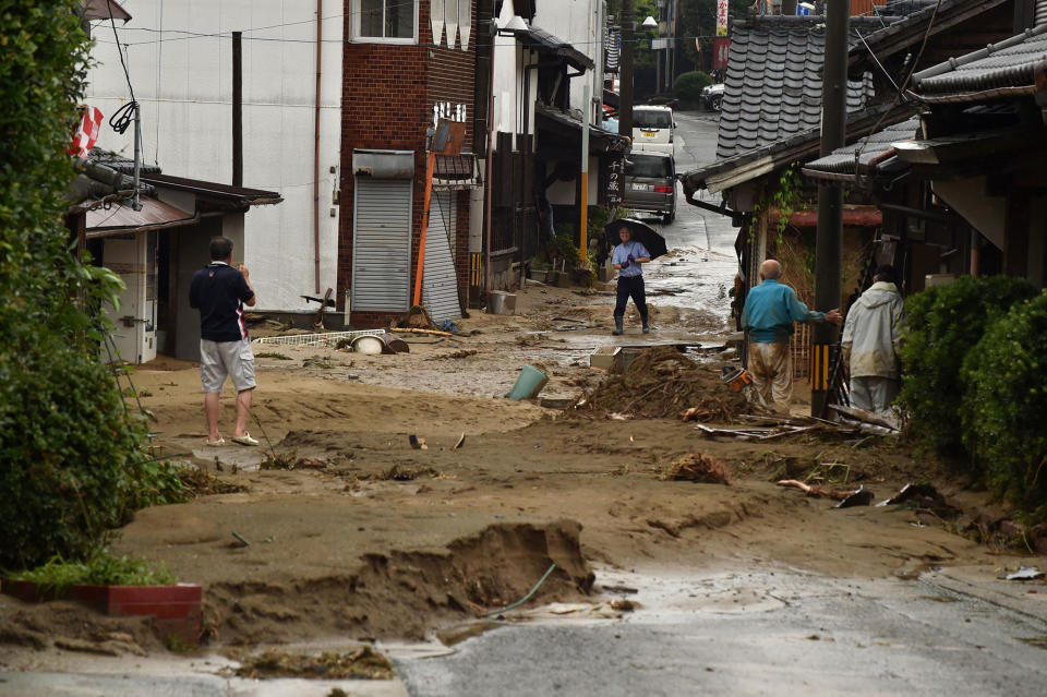 A street is filled with mud