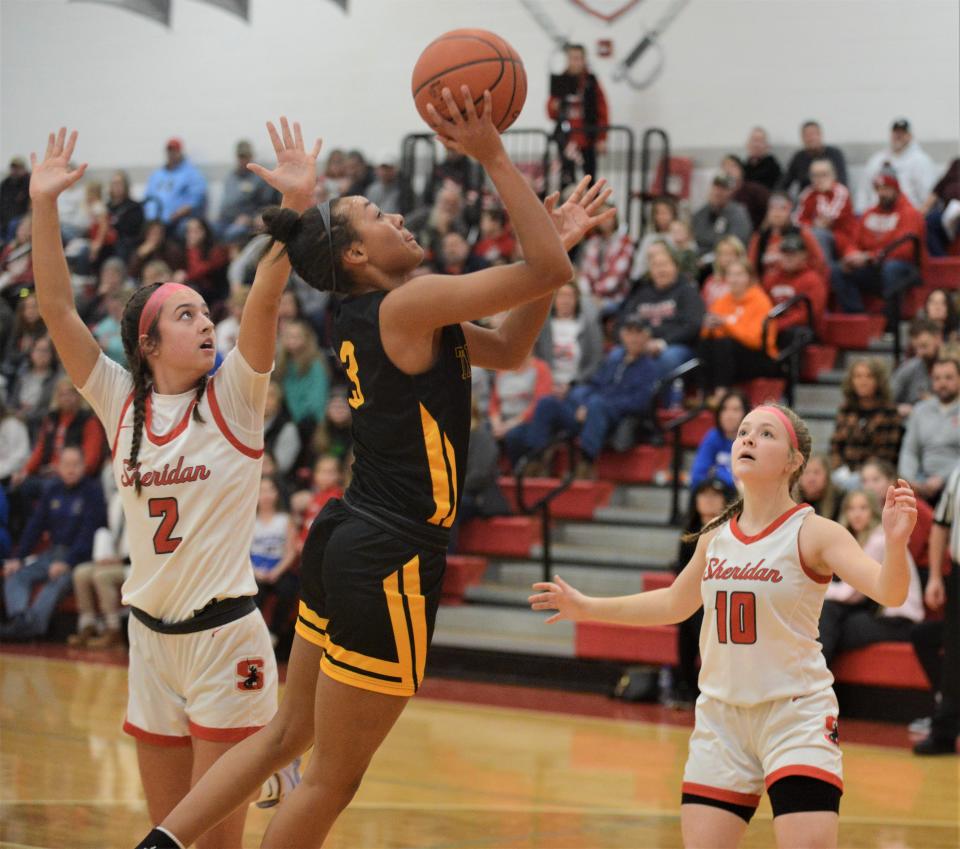 Tri-Valley's Lexi Howe goes up for a shot against Sheridan's Halle Warner in a game earlier this season. Howe was a Division I first-team selection in the East District.