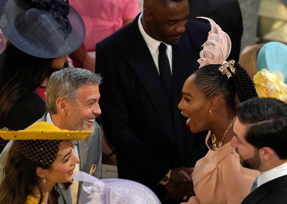 George Clooney (2L) and his wife British lawyer Amal Clooney (L) talk with US tennis player Serena Williams (2R) and her husband Alexis Ohanian (R) during the wedding ceremony of Britain's Prince Harry, Duke of Sussex and US actress Meghan Markle in St George's Chapel, Windsor Castle, in Windsor, on May 19, 2018