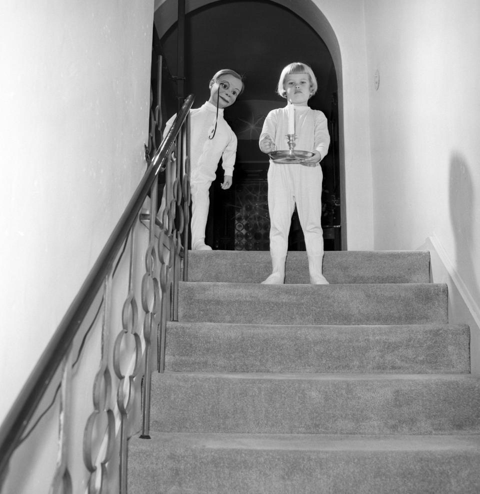 <p>A young Candace Bergen, who is roughly the same height as the mannequin behind her, decides to wait up for Santa Clause on Christmas Eve. </p>