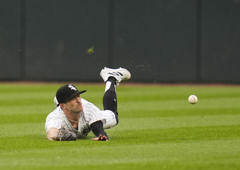 Chicago White Sox center fielder Duke Ellis dives for but misses a line drive hit by Boston Red Sox's Ceddanne Rafaela during the seventh inning of a baseball game Saturday, June 8, 2024, in Chicago. (AP Photo/Erin Hooley)