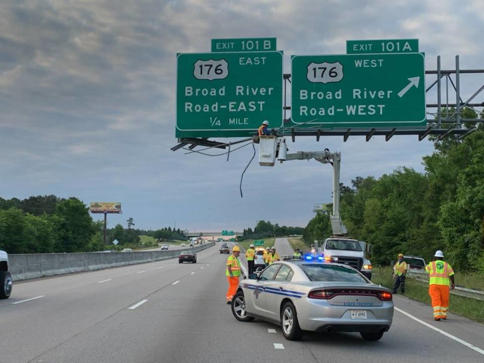 Crews work to repair a sign that was hit by a truck, according to South Carolina Highway Patrol.