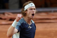 Russia's Andrey Rublev clenches his fist after winning the fourth set against Croatia's Marin Cilic during their quarterfinal match at the French Open tennis tournament in Roland Garros stadium in Paris, France, Wednesday, June 1, 2022. (AP Photo/Jean-Francois Badias)