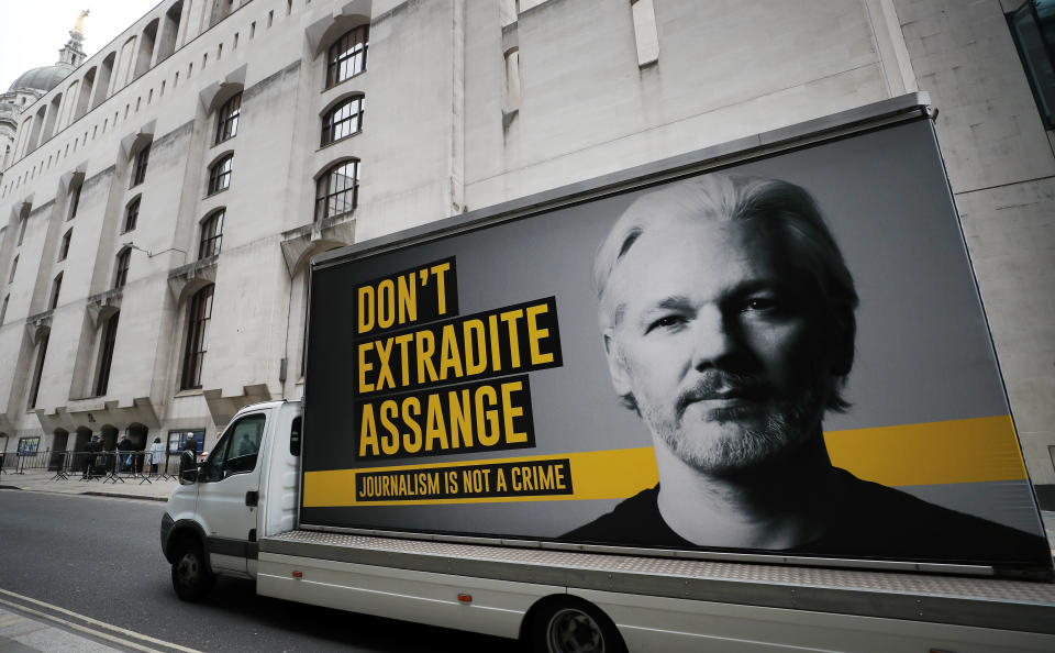 A lorry with a billboard of Julian Assange arrives at the Old Bailey court in London, Monday, Sept. 21, 2020 as the Julian Assange extradition hearing to the US continues. (AP Photo/Frank Augstein)