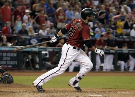 Sep 24, 2017; Phoenix, AZ, USA; Arizona Diamondbacks right fielder J.D. Martinez (28) hits a walk off RBI single against the Miami Marlins at Chase Field. Rick Scuteri-USA TODAY Sports