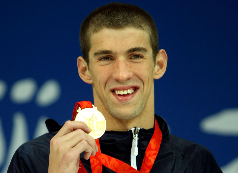 <b>Medal No. 9</b><br>Michael Phelps receives the gold medal during the medal ceremony for the Men's 400m Individual Medley in Beijing. He finished the race in a time of 4:03:84, a new World Record.