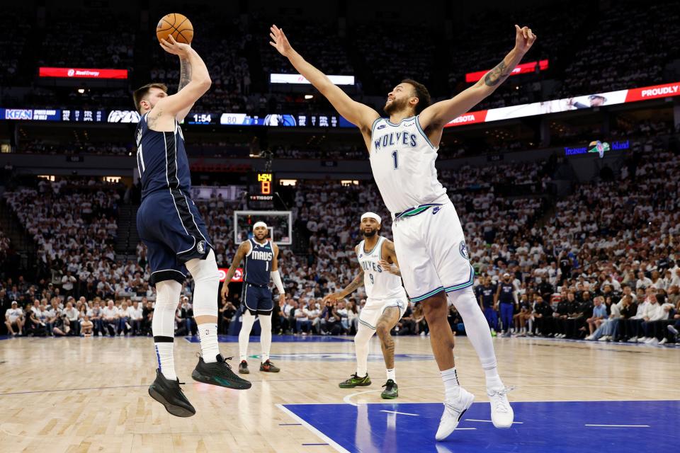 MINNEAPOLIS, MINNESOTA - MAY 22: Luka Doncic #77 of the Dallas Mavericks shoots the ball against Kyle Anderson #1 of the Minnesota Timberwolves during the third quarter in Game One of the Western Conference Finals at Target Center on May 22, 2024 in Minneapolis, Minnesota. NOTE TO USER: User expressly acknowledges and agrees that, by downloading and or using this photograph, User is consenting to the terms and conditions of the Getty Images License Agreement. (Photo by David Berding/Getty Images)