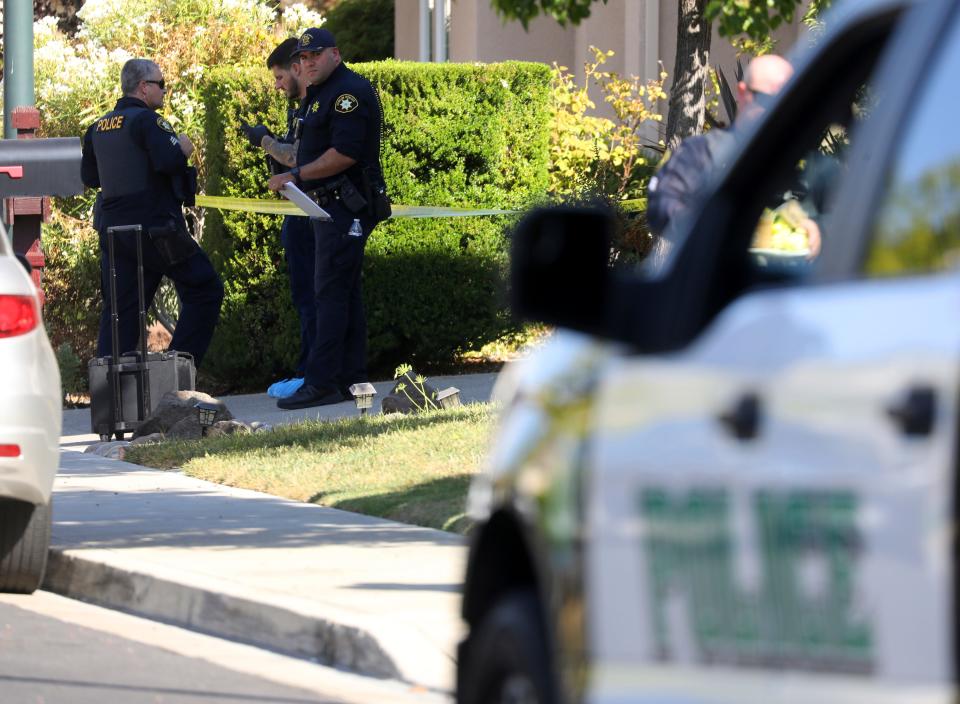 Police officers work the scene of a double homicide at a home on Wednesday, Sept. 7, 2022, in Dublin, Calif. Devin Williams Jr., an Alameda County Deputy Sheriff, is accused in the double-slaying.