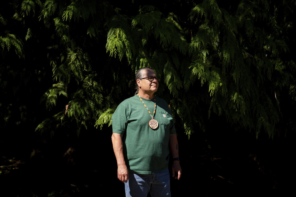 Michael Durglo Jr., climate change advisory committee chairman for the Confederated Salish and Kootenai Tribes in Montana, poses for a portrait at NatureBridge in the Olympic National Park during the 2023 Tribal Climate Camp, Thursday, Aug. 17, 2023, near Port Angeles, Wash. Participants representing at least 28 tribes and intertribal organizations gathered to connect and share knowledge as they work to adapt to climate change that disproportionally affects Indigenous communities. More than 70 tribes have taken part in the camps that have been held across the United States since 2016. (AP Photo/Lindsey Wasson)