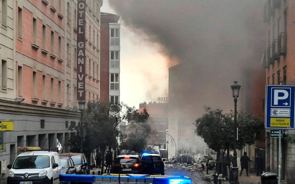 Smoke rises from a building and rubble scattered in Toledo Street following a explosion in downtown Madrid - Europa Press 