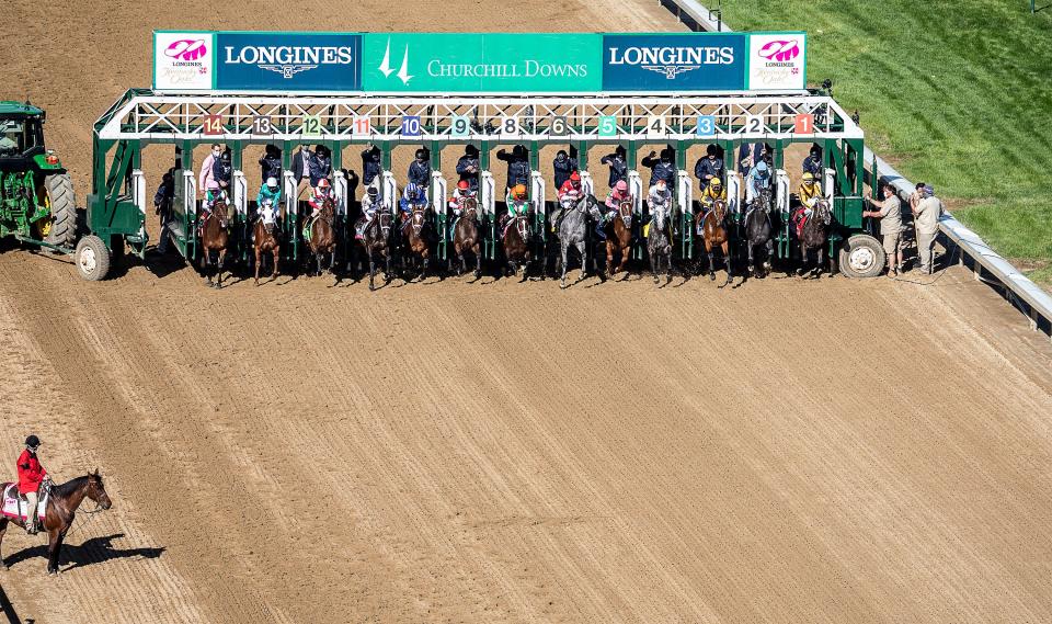 The horse break from the gate at the start of the 147th running of the Kentucky Oaks.