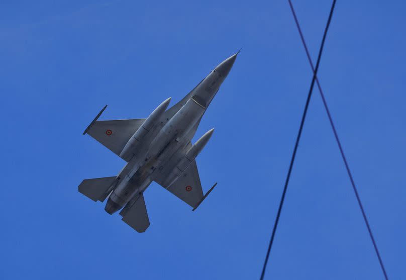 FILE - A Romanian air force F16 fighter jet flies during the National Day parade in Bucharest, Romania, Thursday, Dec. 1, 2016.